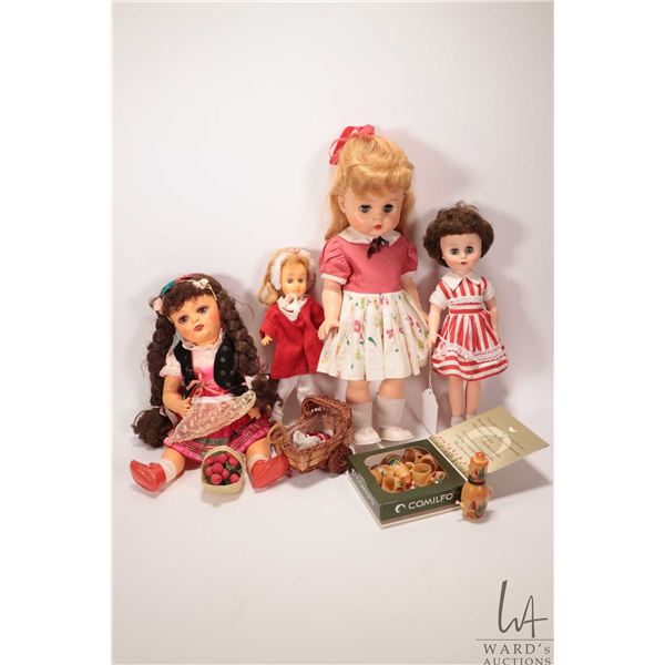 Selection of vintage dolls and a small wooden tea set