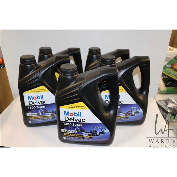 Five 3.78 ltr containers of Mobil Deluxe 1300 Super 15W-40 motor oil