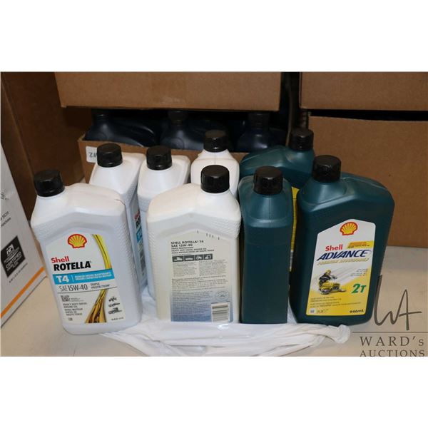Five 946 ml containers of Shell Rotella T4 SAE 15W-40 heavy duty diesel oil and three 946 ml contain