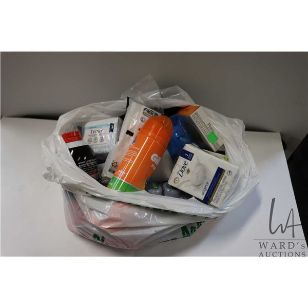 Selection of bathroom essentials including shampoo, conditioner, hand soap, deodorant, shaving needs