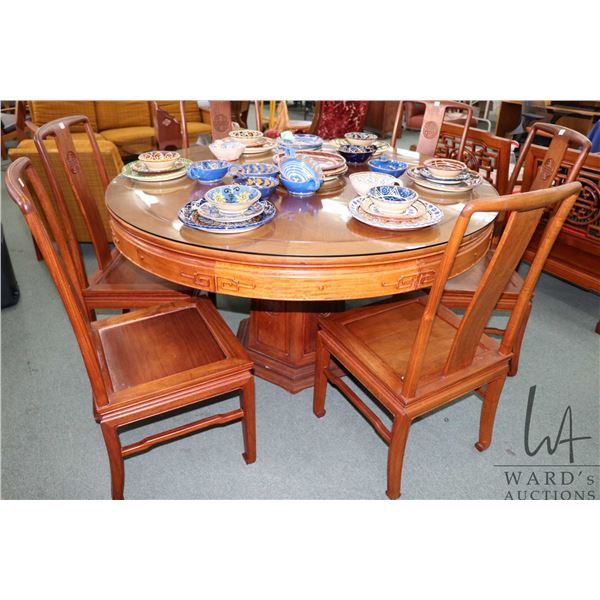 Large Oriental rosewood dining table with mid center pedestal and glass top protector 54" in diamete