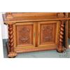 Image 2 : Antique book shelf with four adjustable shelves in top section, two carved raised panel doors in bas