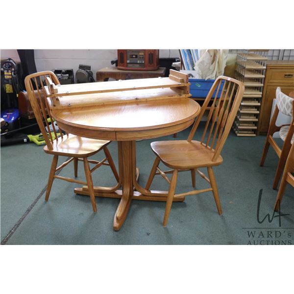 Modern 41" diameter center pedestal dinette table with two 12" insert leaves plus two spindle back c
