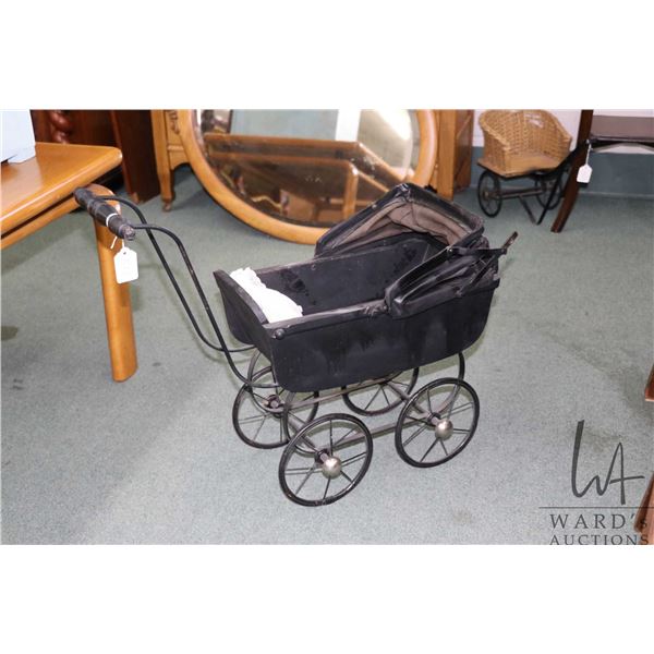 Antique doll pram with oil cloth bonnet, 21" to top of handle