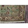 Image 2 : Wool area carpet with geometric floral design, green backgrounds, highlights of red, sage, cream etc