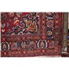 Image 2 : 100% handmade Iranian wool carpet "Mashad" with center medallion, red background and overall floral 