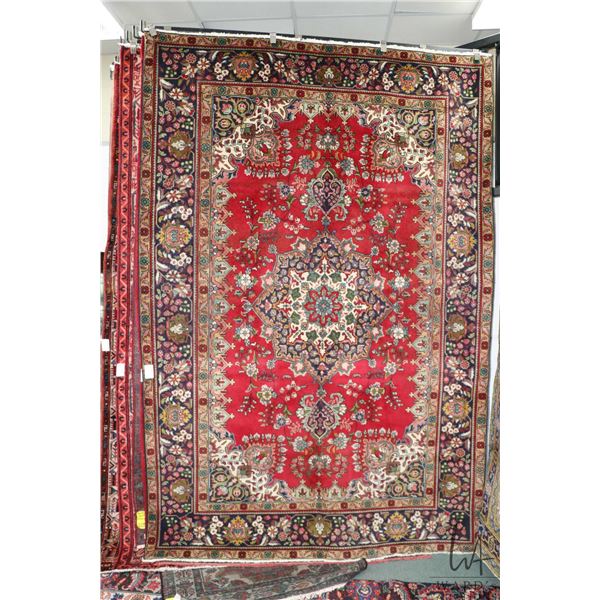 100% handmade Iranian wool carpet "Tabriz" with center medallion, red background, floral pattern and