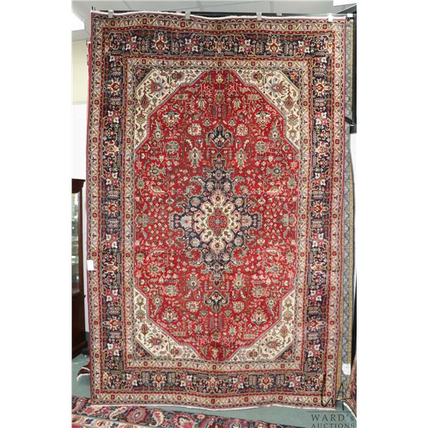 100% handmade Iranian wool carpet "Tabriz" with center medallion, red background, floral pattern and