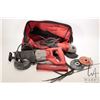 Image 1 : Two Milwaukee power including reciprocating saw with blades and a 4 1/2" grinder in a Milwaukee tool