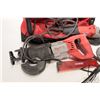 Image 2 : Two Milwaukee power including reciprocating saw with blades and a 4 1/2" grinder in a Milwaukee tool