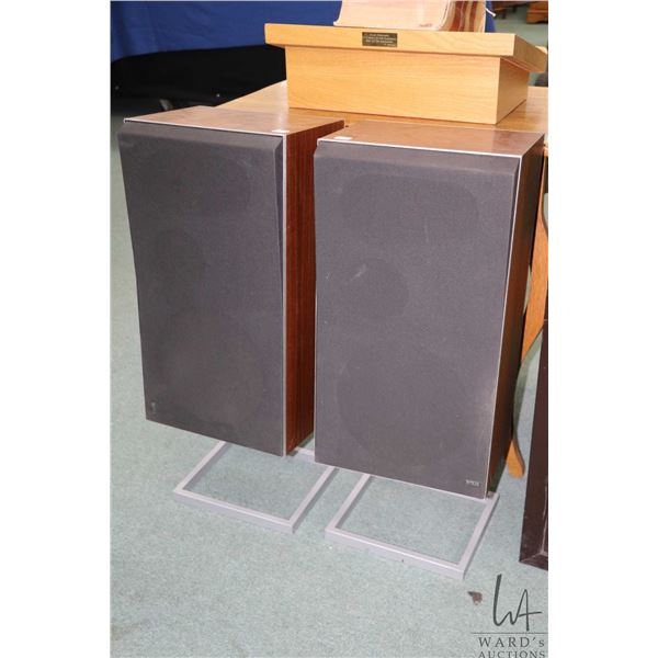 Pair of vintage Bang & Olufsen model BEOVOX S75 speakers on adjustable tilt stand and includes propr