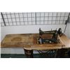 Image 2 : Two antique sewing machines including a Goodrich "B" treadle in oak and metal cabinet plus a hand cr