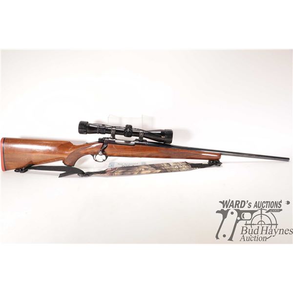 Non-Restricted rifle Ruger model M77, 243 Win bolt action, w/ bbl length 22" [Blued barrel and recei