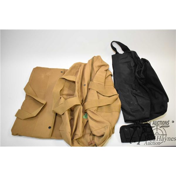 Three duffel bags including two canvas and one Three duffel bags including two canvas and one webbed