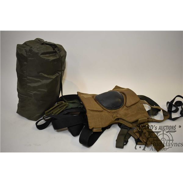 Bag of assorted straps, harness, pouches, etc. Bag of assorted straps, harness, pouches, etc. Plus k