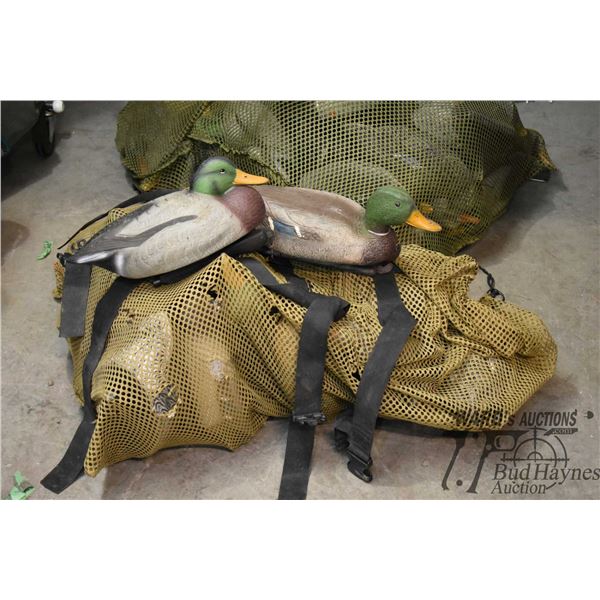 Bag w/ 21 floating duck decoys of assorted types Bag w/ 21 floating duck decoys of assorted types