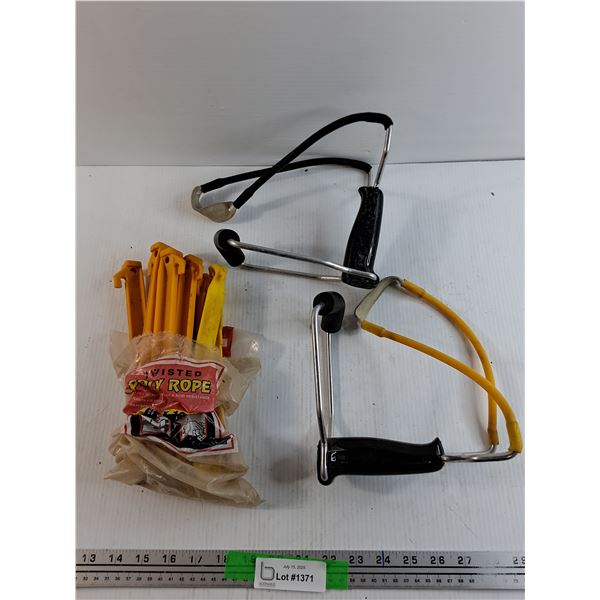 (2)  Slingshots and Tent Pegs