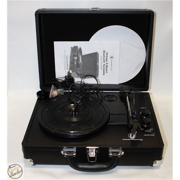 RECORD PLAYER IN BLACK BOX WITH GLASS TABLE