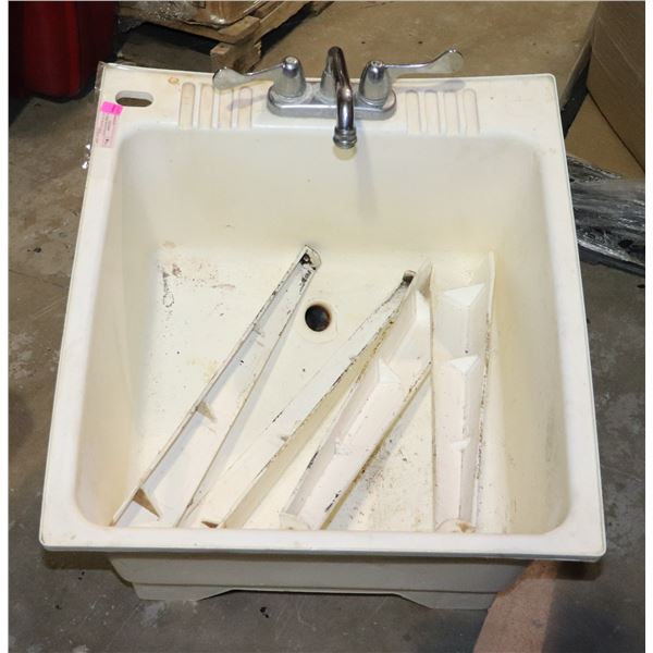 UTILITY SINK WITH FAUCET, DAMAGE TO DRAIN AREA