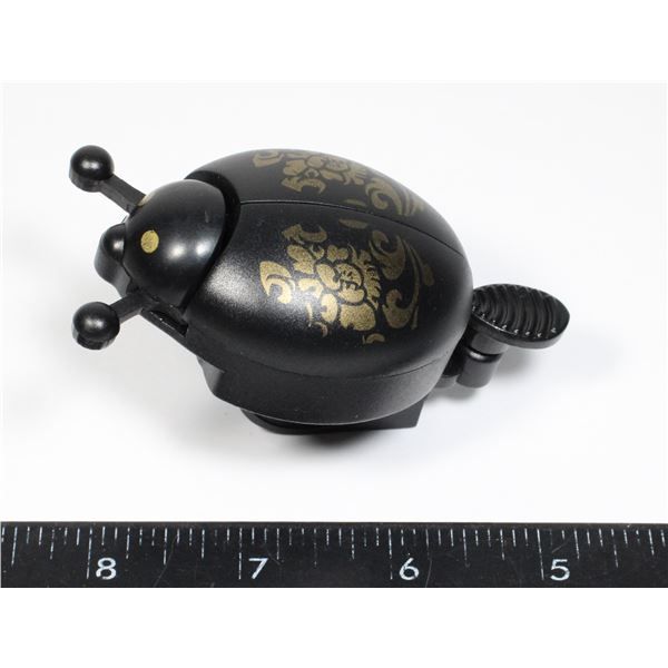 NEW LADY BUG BELL. TAB FLICKS THE BELL TO WORK