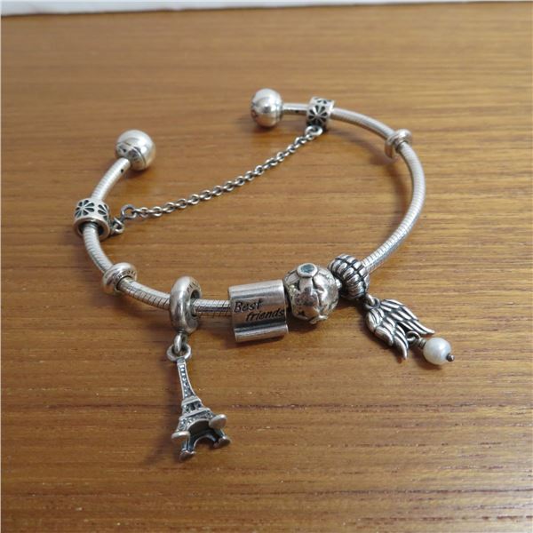 PANDORA bangle bracelet - 925 Silver.  Includes 4 charms and a safety chain charm.  Very nice!
