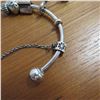 Image 2 : PANDORA bangle bracelet - 925 Silver.  Includes 4 charms and a safety chain charm.  Very nice!