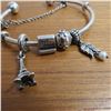 Image 3 : PANDORA bangle bracelet - 925 Silver.  Includes 4 charms and a safety chain charm.  Very nice!