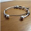 Image 5 : PANDORA bangle bracelet - 925 Silver.  Includes 4 charms and a safety chain charm.  Very nice!