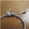 Image 6 : PANDORA bangle bracelet - 925 Silver.  Includes 4 charms and a safety chain charm.  Very nice!