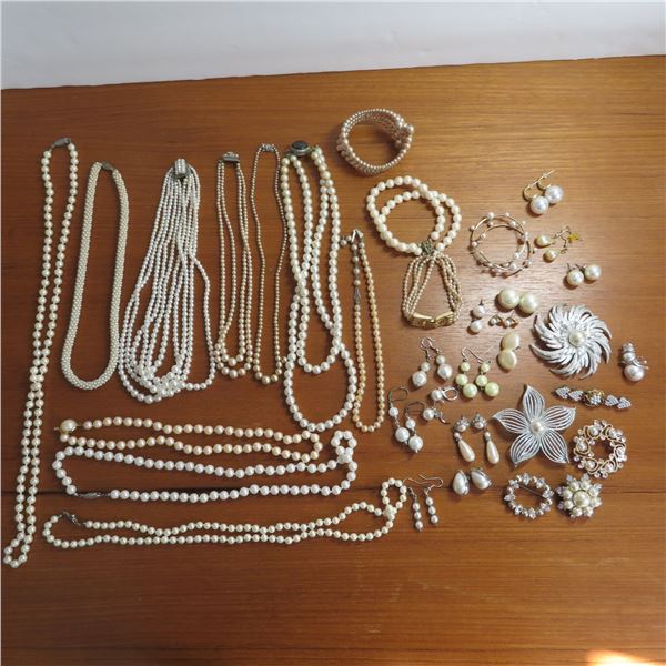 Vintage Pearl lot.  Includes 15 pairs of pierced earrings, 7 brooches, 3 bracelets & 10 necklaces