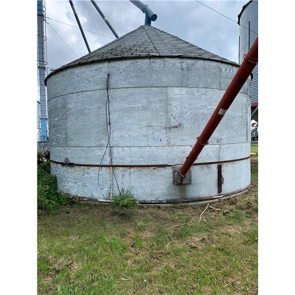 Round Wood Grain Bin on Concrete c/w auger system. Grain Bins to be Removed by Oct 1st. PH Jovi (780