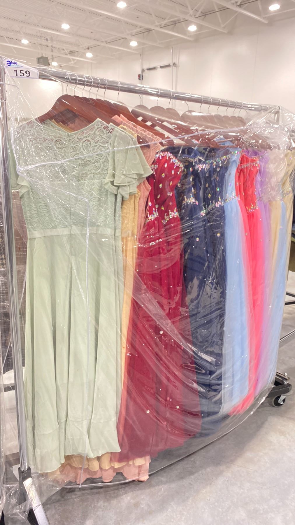 RACK OF ASSORTED WARDROBE CLOTHING *RACK INCLUDED & MUST BE TAKEN ...