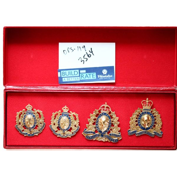 RCMP Badges; Group of 4 different 1873-1973 Centennial badges housed red velvet case.