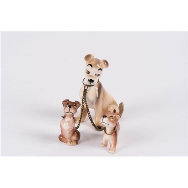 A Tramp with Two Puppies Goebel Figurine Set.