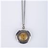 Image 1 : A Sleeping Beauty Castle Locket Necklace.