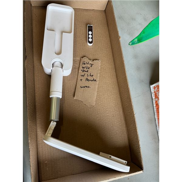 Folding selfie stand with light and remote working