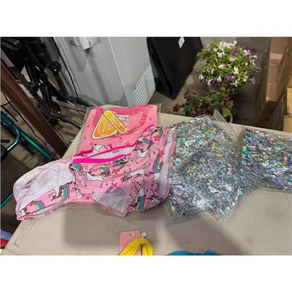 Children's bathing suit and beach balls