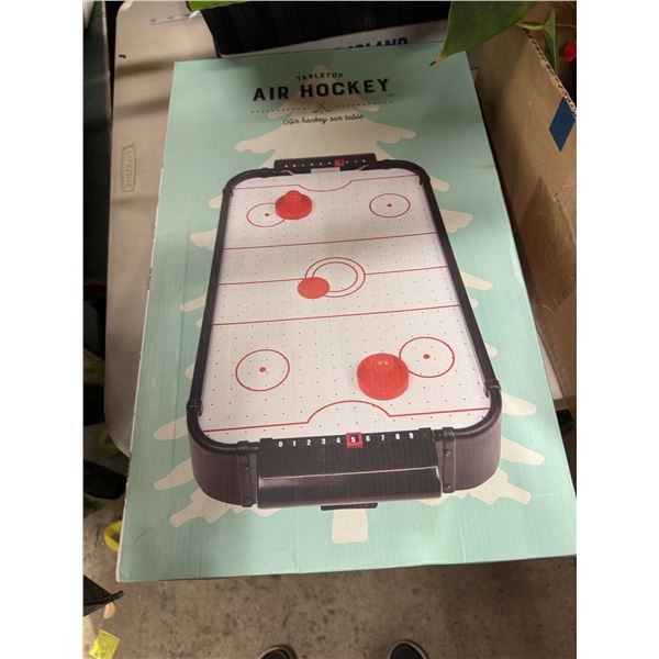 Tabletop air hockey game