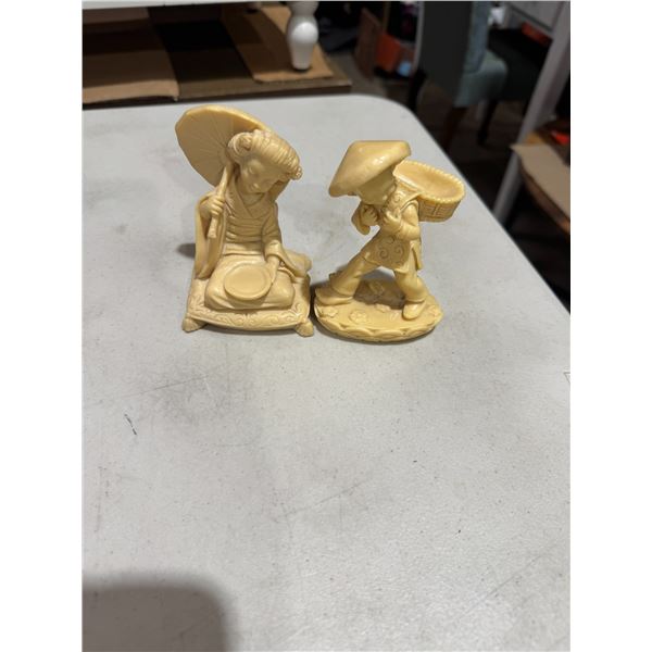Asian couple figurines