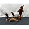 Image 1 : Wooden Dolphin Carvings
