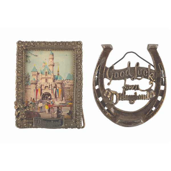 A Disneyland Souvenir Picture Frame and Horseshoe.