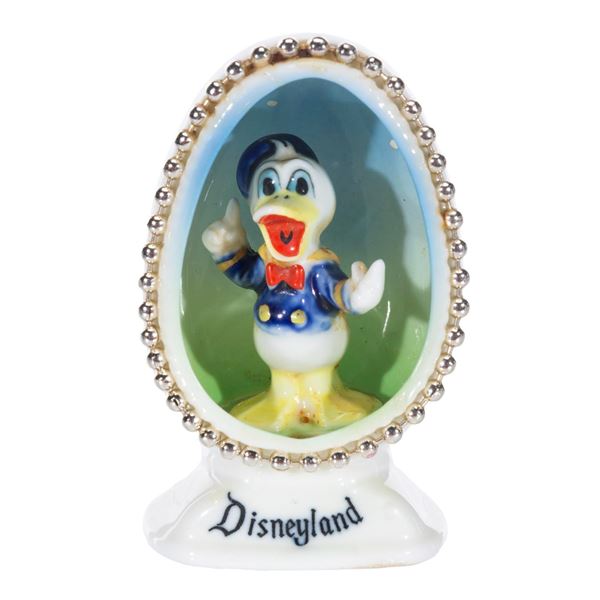 A Disneyland Donald Duck China Egg Figurine.