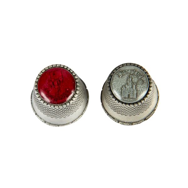 A Pair of Disneyland Castle Logo Pewter Thimbles.