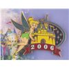 Image 3 : A Tinker Bell Pin and Guest Service Fanatic Card.