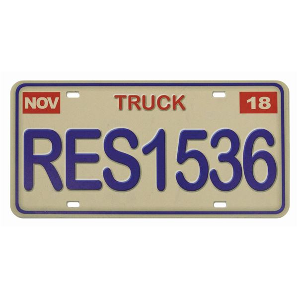 A Pixar Pier Toy Story Pizza Planet Truck License Plate.