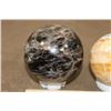 Image 6 : (1) BLACK MOONSTONE Mineral Sphere and (1) Banded ORANGE CALCITE Mineral Sphere (ONE$)
