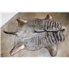 Image 1 : BLUE WILDEBEEST Hide Rug with Leather Piping, a Canvas Backing, and Hanging Loops