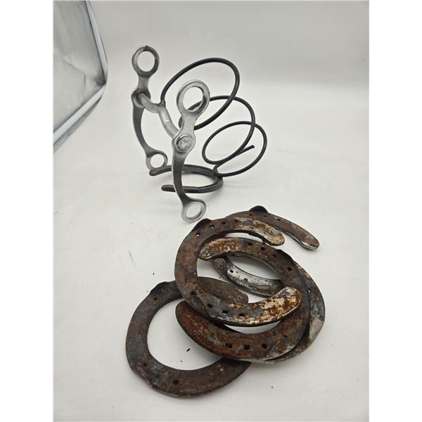 wine bottles stand and horse shoes