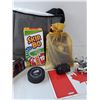 Image 3 : Hockey Puck and Laces, Skip Bo, Hand Cuffs, Lego Pieces, Metal Canada Flag, Book & Bag