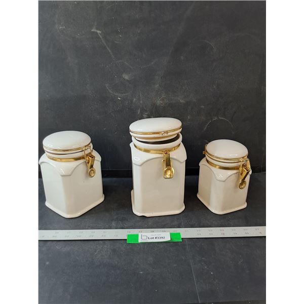 (3) White Ceramic Jars- One is Filled w/ Tea